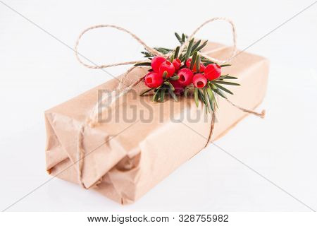 Gift Decorated With A Gunny String Bow And With A Common Yew Twig