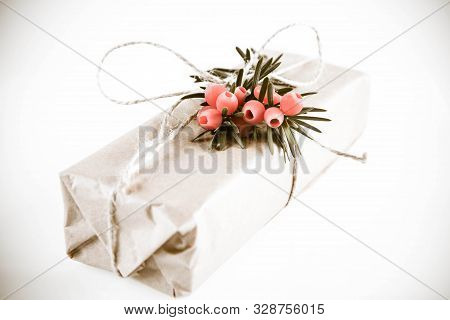 Gift Decorated With A Gunny String Bow And With A Common Yew Twig