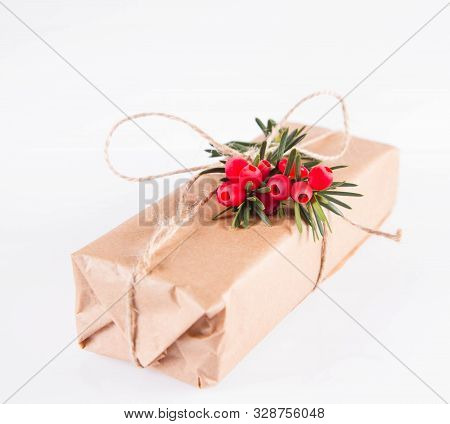 Gift Decorated With A Gunny String Bow And With A Common Yew Twig