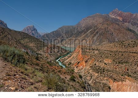 Tajikistan. The Pamir Highway. Panorama Of The Mountain River Iskanderdarya Flowing From Lake Iskand