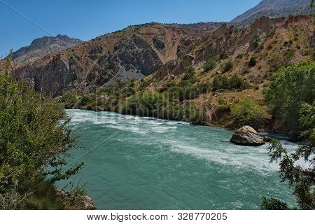 Tajikistan. The Pamir Highway. Panorama Of The Mountain River Iskanderdarya Flowing From Lake Iskand