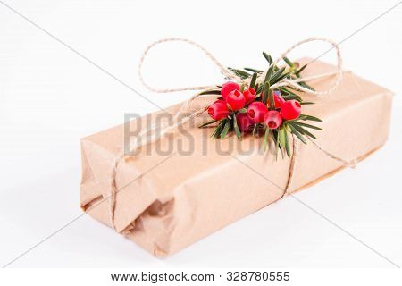 Gift Decorated With A Gunny String Bow And With A Common Yew Twig