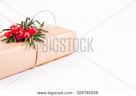 Gift Decorated With A Gunny String Bow And With A Common Yew Twig