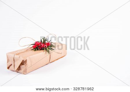 Gift Decorated With A Gunny String Bow And With A Common Yew Twig