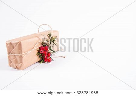 Gift Decorated With A Gunny String Bow And With A Common Yew Twig
