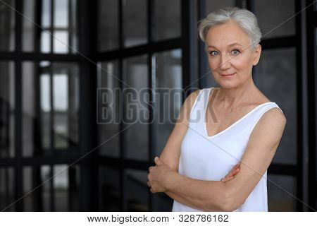 Portrait Of Happy Mature Woman Indoors, Space For Text. Smart Aging