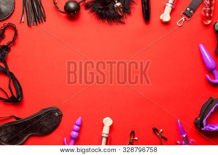 Bdsm Kit From Sex Shop. Leather Whip, Buttplug, Vibrator, Handcuffs, Dildo, Nipple Clamps And Other 