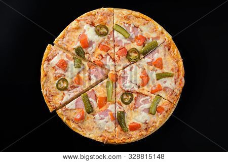 Whole Hot Pizza Isolated On Black Background