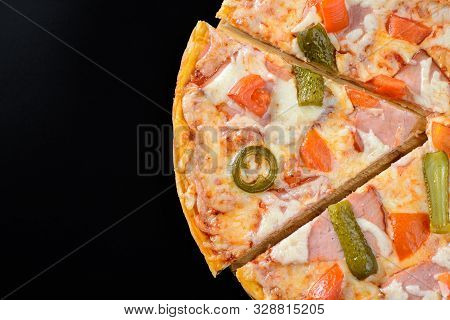 Segment Of Hot Pizza Isolated On Black Background