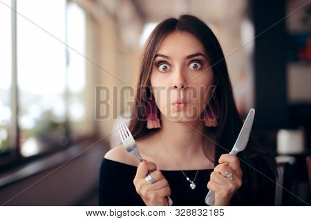 Hungry Woman With Knife And Fork Ready To Eat