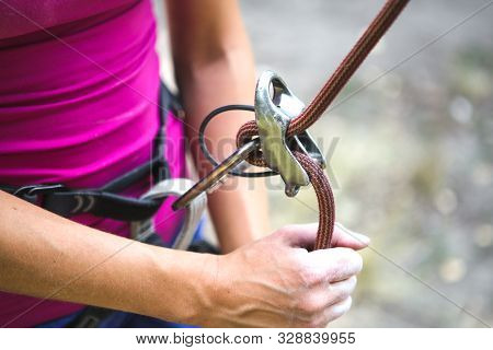 Climbing Belaying. A Woman Insures Her Partner. Safety Equipment. Safety System. Rock Climbing Safet
