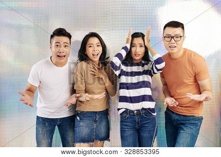 Young Vietnamese People Experincing Various Emotions Like Shock And Fear When Looking At Camera