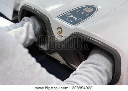 Female Makes Cosmetology Procedure With Massage Apparatus - Hand Press Massage Machine Korean Flexi 
