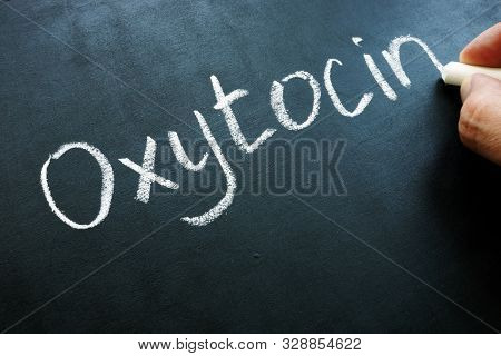 Oxytocin Oxt Hormone Handwritten On The Blackboard.