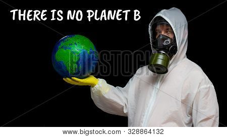 There Is No Planet B - A Man In A Gas Mask And A Chemical Protection Suit Protests. A Person Speaks 