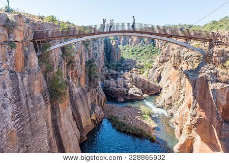 Bourkes Luck, South Africa - May 20, 2019: Unidentified Tourists On A Pedestrian Bridge Over The Bly