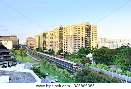 Singapore-09 May 2018:a Train Leaving Payalebar Mrt Station In Singapore