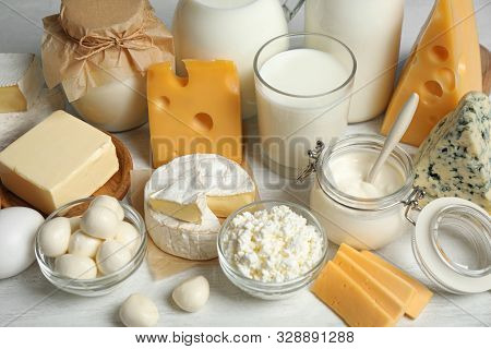 Different Delicious Dairy Products On White Table