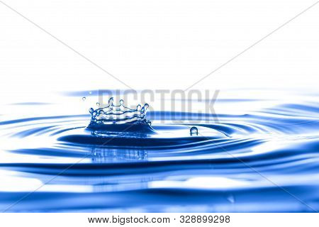Splash Crown Shape Of Drop Water In Blue Tone, Blank Spce From Above To Create Concepttual.