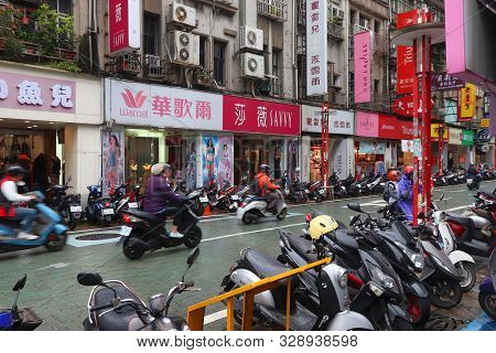 Keelung, Taiwan - November 23, 2018: People Ride Scooters In Keelung, Taiwan. Keelung Is The 9th Mos