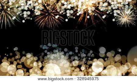 New Year fireworks and blurred bokeh lights background
