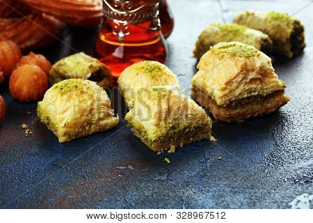 Baklava On Table. Middle Eastern Or Arabic Dishes. Turkish Dessert Baklava With Pistachio On Rustic