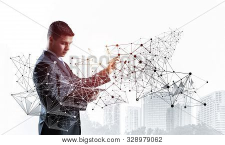 Business Person Pointing On Abstract Network Structure. Standing Personal Assistant In Business Suit