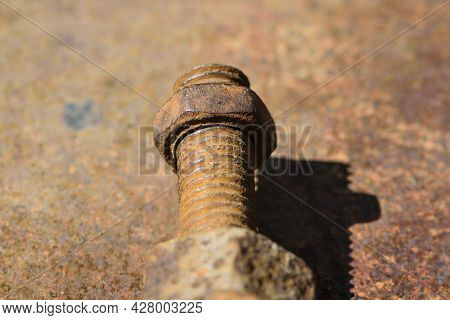 Old Rusty Bolt, Iron Rod With Screw Threads. Rusted Mechanical Components. Threaded Bolt And Nut Iso