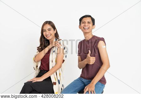 Asian Patient Getting Vaccinated Against Coronavirus By Doctor