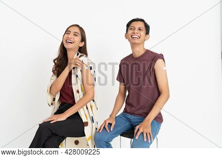 Asian Patient Getting Vaccinated Against Coronavirus By Doctor