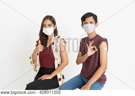 Asian Patient Getting Vaccinated Against Coronavirus By Doctor