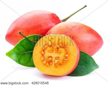 Ripe tamarillo fruits with slices and tamarillo leaves isolated on a white background.