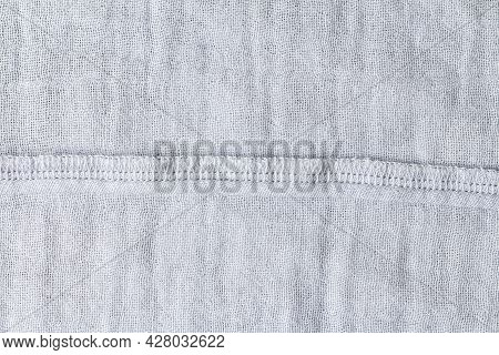 A Horizontal Seam On The Inside Of A Light-colored Fabric. Seamy Side
