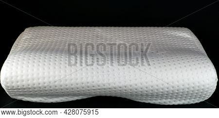 Orthopedic Pillow On A Black Background. Memory Foam Pillow.