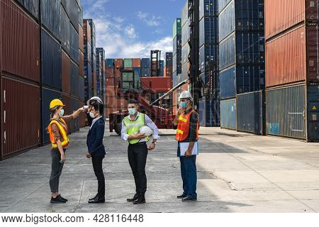 Engineer Worker Wearing Surgical Mask Checking Body Temperature Using Infrared Digital Thermometer C