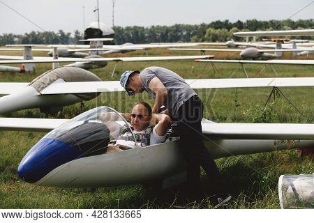 Soaring Club, Getting Ready For The Flight On Glider Airplane. Small Aviation Sport. Two Man Checkin
