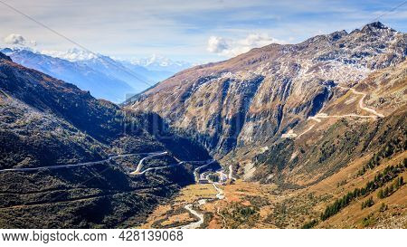 Scenic view of a switchback road through the mountains in Switzerland