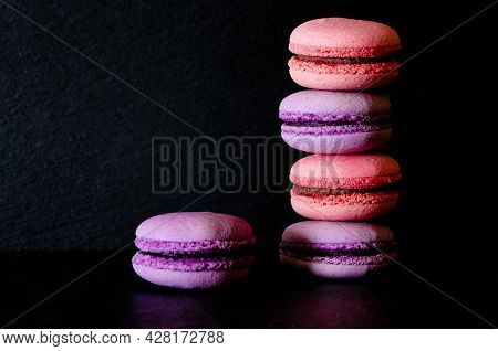 Macarons On Dark Background. French Pastry Makaron. Selective Focus