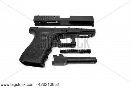 9mm Pistol Is Separated To Pieces On White Background.