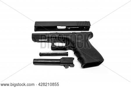 9mm Pistol Is Separated To Pieces On White Background.