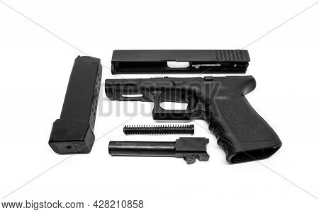 9mm Pistol Is Separated To Pieces On White Background.