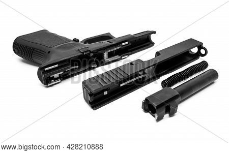 9mm Pistol Is Separated To Pieces On White Background.