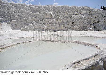 Wall With Travertine Deposits, Terraces And Pools With Hydrothermal Solution.