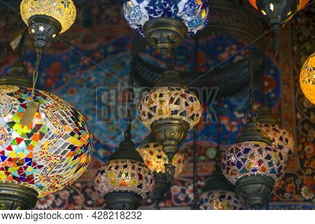 Middle Eastern Lambas Of Different Colors And Sizes Are Hanging In The Bazaar. Bright Traditional Ar