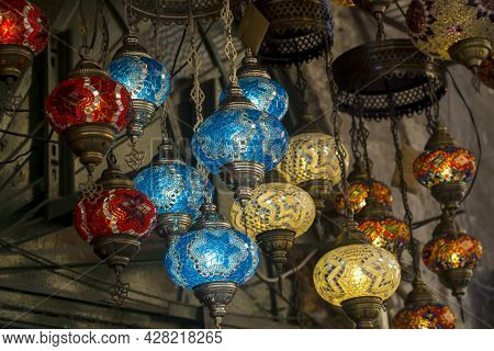 Middle Eastern Lambas Of Different Colors And Sizes Are Hanging In The Bazaar. Bright Traditional Ar