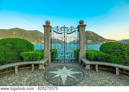 Gate On The Lugano Lake In The Public Ciani Park Of Switzerland. The Lakefront Of Lugano City In Tic