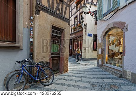 Strasbourg, France, June 23, 2021 : Cycling In The Small Streets Of Strasbourg City Center Near The 