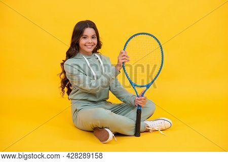 Kid In Sportswear Hold Racket. Child With Racquet. Teen Girl Relax After Sport Workout.