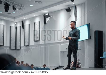 Speaker Giving A Lecture On Stage In The Conference Hall.