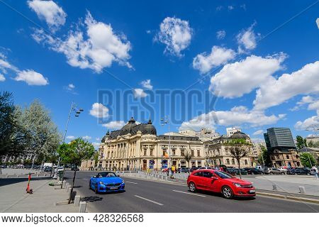 Bucharest, Romania, 6 May 2021: The Central University Library With Equestrian Monument To King Caro